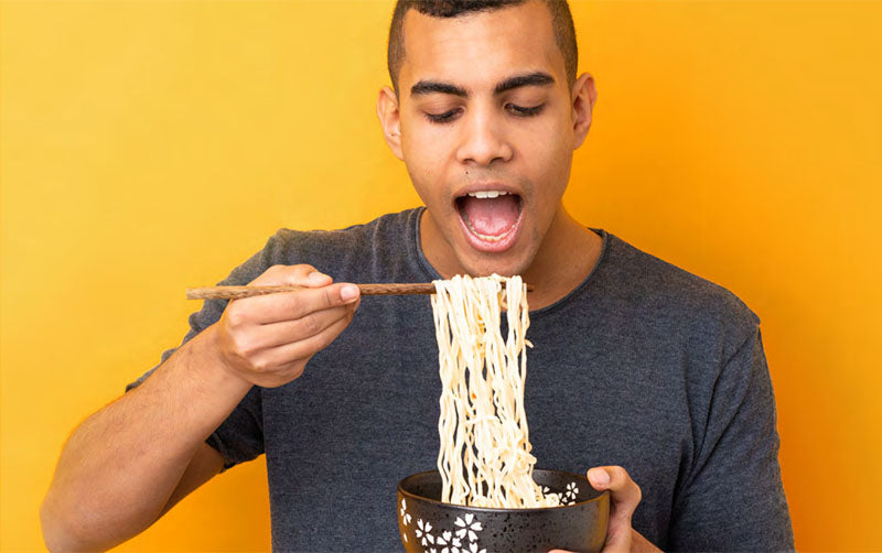 Man eating spaghetti